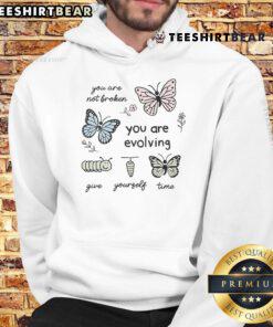 Cute hoodie with 'You Are Not Broken, You Are Evolving, Give Yourself Time' inspirational quote design.