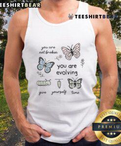 Alt Text: Cute tank top with 'You Are Not Broken, You Are Evolving, Give Yourself Time' motivational quote design.