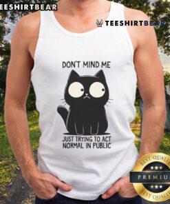 Funny cat in a tank top pretending to act normal in public, showcasing its quirky personality and playful charm.