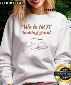 Funny Eggs We Is Not Looking Good sweatshirt featuring a humorous graphic and vibrant colors for casual wear.