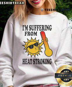 Funny sweatshirt saying 'I'm Suffering From Heat Stroke' with playful graphics, perfect for summer humor and relaxation.