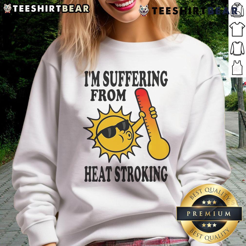 Funny sweatshirt saying 'I'm Suffering From Heat Stroke' with playful graphics, perfect for summer humor and relaxation.