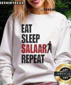 Front view of a stylish 'Good Eat Sleep Salaar Repeat' Indian action sweatshirt in vibrant colors on a model.