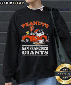 Good San Francisco Giants sweatshirt featuring peanuts, posing next to a car, showcasing team spirit and fun.