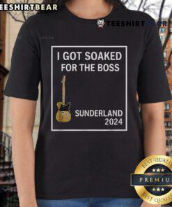 Alt Text: Happy woman wearing a Sunderland 2024 ladies tee, soaked and smiling, showcasing team spirit and joy.