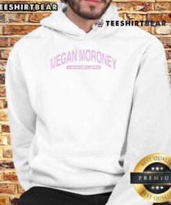 Happy Megan Moroney six months later wearing a stylish hoodie, showcasing her vibrant personality and confident style.