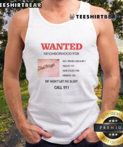 Charli XCX wears a stylish Wanted Neighborhood Fox tank top in a vibrant outdoor setting.