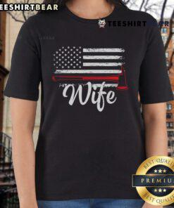 Official Firefighter Wife tee featuring America flag and fire axe design for proud firefighter spouses.