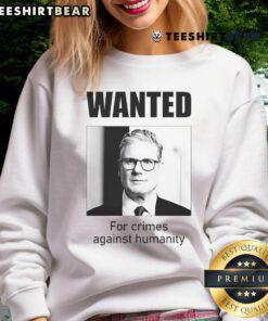 Official Keir Starmer Wanted for Crimes Against Humanity sweatshirt design featuring bold text and striking graphics.