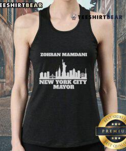 Zohran Mamdani wearing a tank top in New York City, promoting his campaign for mayor in a vibrant urban setting.