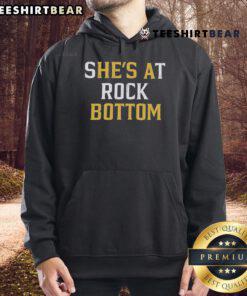 Premium 'She's at Rock Bottom, He's a Bottom' hoodie displayed in a stylish setting, perfect for casual wear.