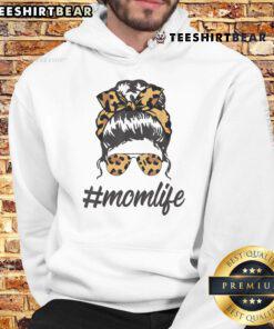 Stylish mom wearing leopard pattern shades and a cool messy bun in a cozy hoodie, embodying top-classy mom life.
