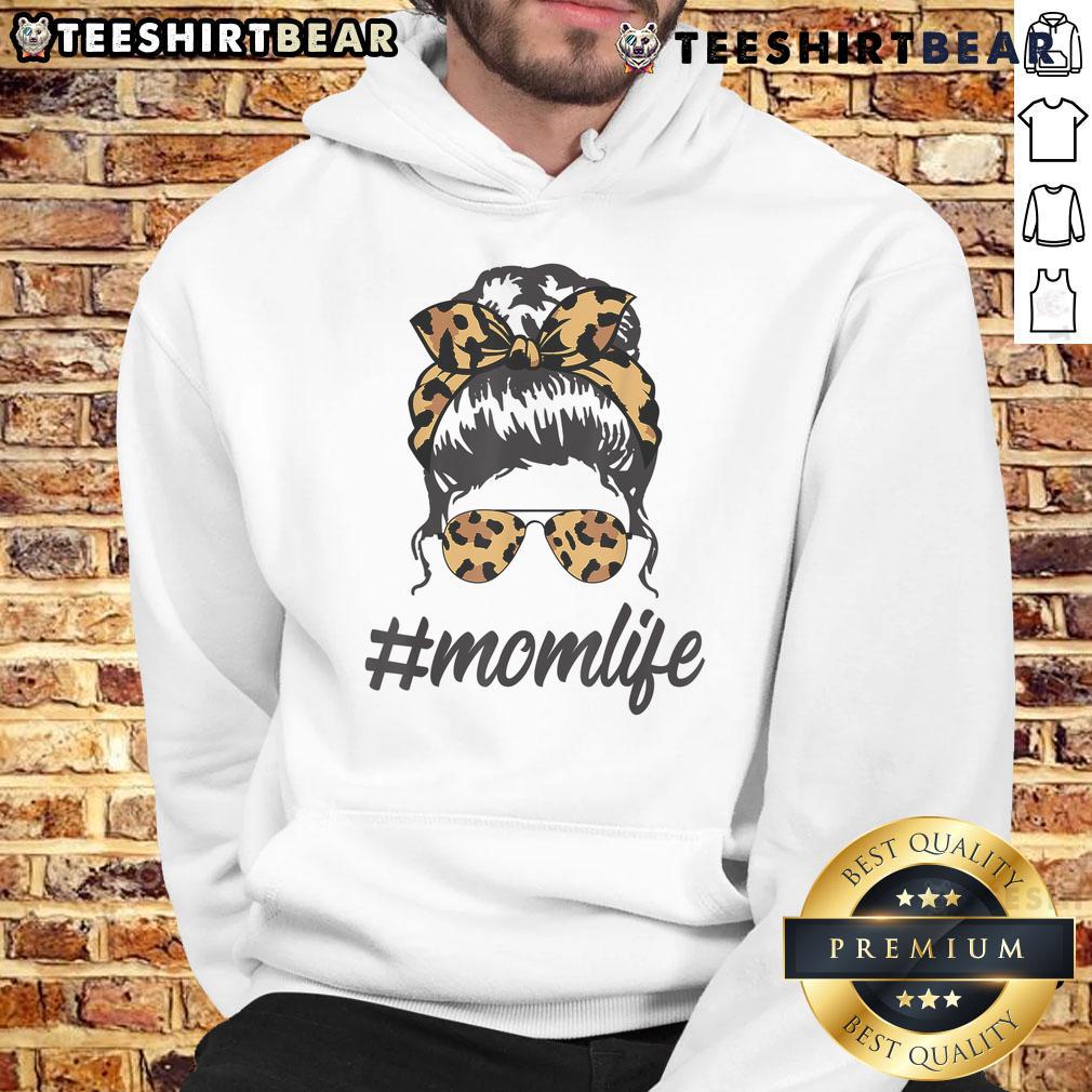 Stylish mom wearing leopard pattern shades and a cool messy bun in a cozy hoodie, embodying top-classy mom life.