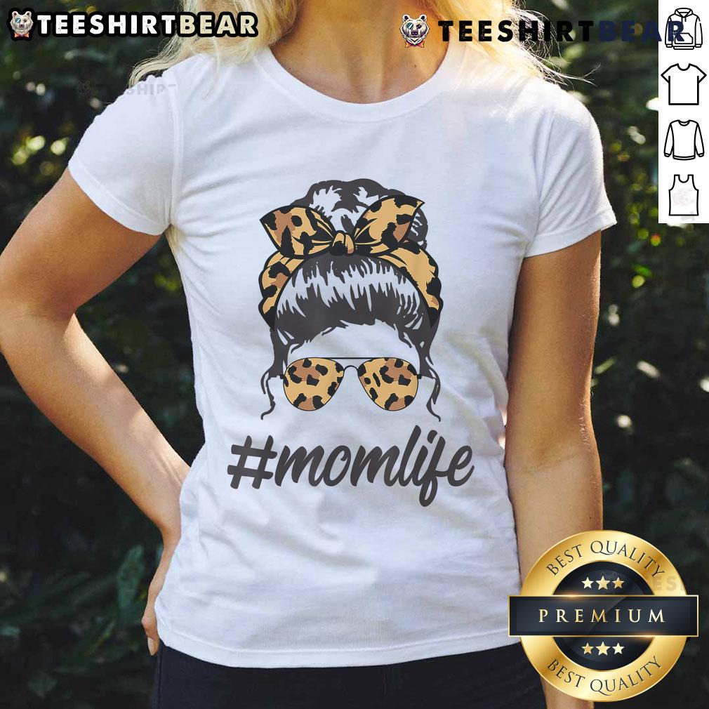 Chic mom wearing a leopard-pattern tee and shades, showcasing a cool messy bunperfect for top classy mom life.