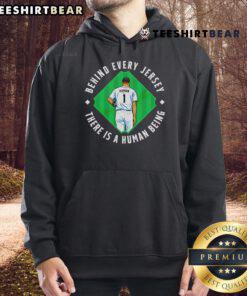 Top Human Behind The Jersey hoodie showcasing a stylish design that emphasizes individuality and connection.