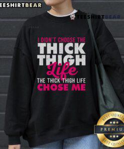 Alt Text: Cozy sweatshirt featuring 'I Didn't Choose The Thick Thigh Life, The Thick Thigh Life Chose Me' design, perfect for curvy fashion.