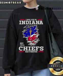 Indiana fan wearing a Kansas City Chiefs sweatshirt, showcasing loyalty to the team despite living in Indiana.