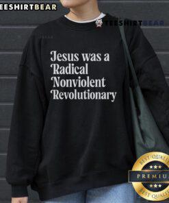 Top Jesus Was A Radical Nonviolent Revolutionary Sweatshirt featuring bold text design on a cozy fabric background.