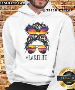 Women in hoodies enjoying lake life with messy buns, showcasing fun moments for moms and grandmas at the lake.