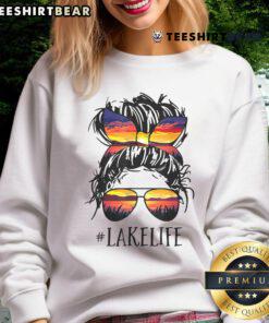 Women in sweatshirts enjoying top lake life with messy buns - perfect for moms, grandmas, and casual outings.