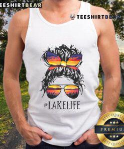 Women in tank tops enjoying lake life, featuring messy buns, perfect for moms and grandmas. Embrace summer vibes!