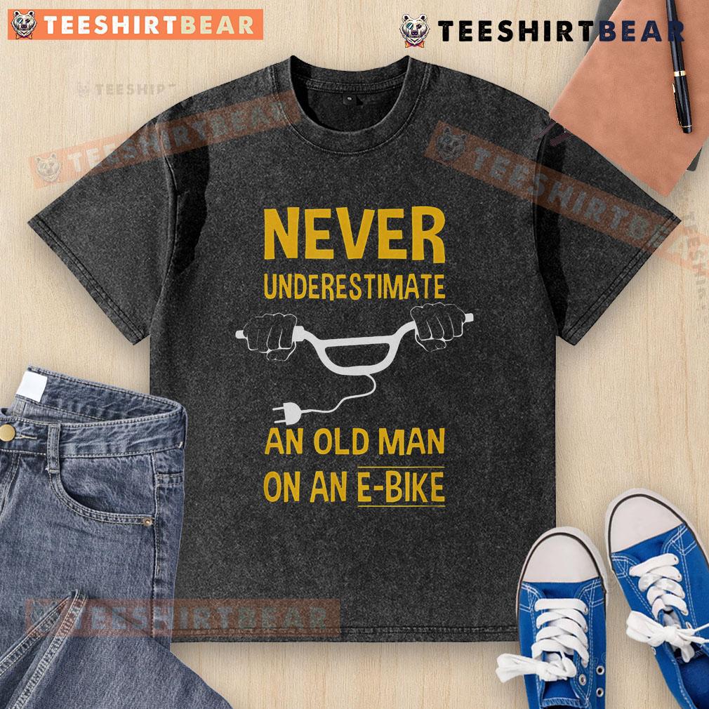 Top Never Underestimate An Old Man On An E-Bike Washed T-Shirt featuring a bold graphic and comfortable fit.