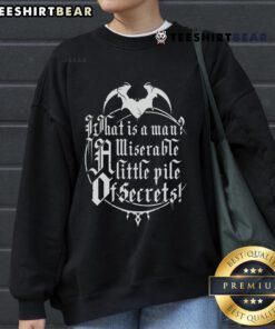 Alt Text: Top What Is A Man? A Miserable Little Pile Of Secrets Sweatshirt featuring a bold graphic design on a cozy fabric.