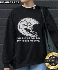 Cozy Snoopy surfing sweatshirt featuring 'Top Will America Ever Pay For What It Has Done' design, perfect for casual wear.