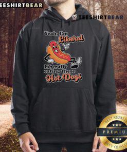 Person wearing a 'Top Yeah I'm Liberal' hoodie while enjoying hot dogs at a picnic, showcasing a fun liberal lifestyle.