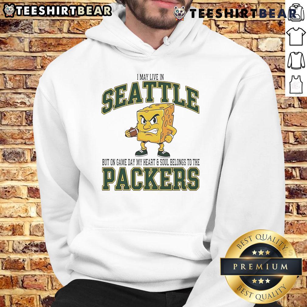 Fan wearing a Green Bay Packers hoodie, showcasing team spirit on game day in Seattle.