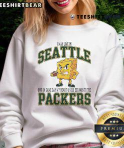 Green Bay Packers sweatshirt worn proudly in Seattle, showcasing team spirit on game day.