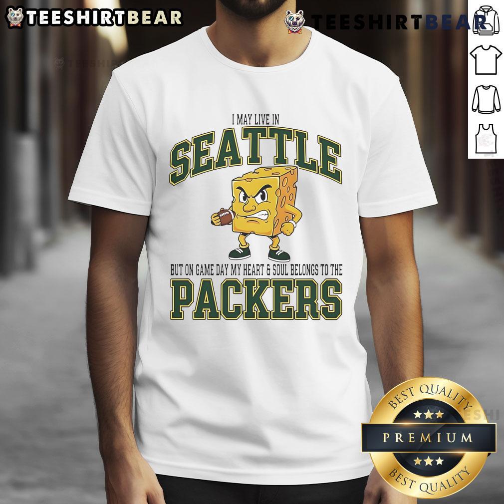 Green Bay Packers t-shirt with 'I may live in Seattle but on game day, my heart belongs to Packers' text design.