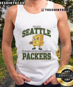 Alt Text: Woman in a Green Bay Packers tank top, showcasing team spirit on game day in Seattle.