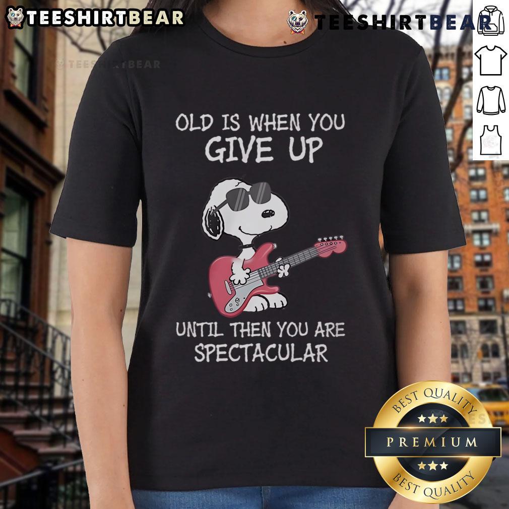 Awesome Snoopy guitar design on a ladies tee with the quote about aging and staying spectacular. Perfect for music lovers!