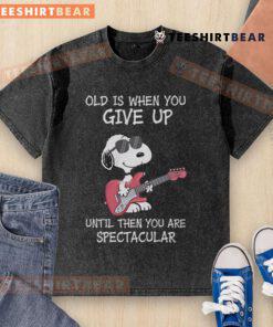 Awesome Snoopy guitar design on a washed t-shirt with 'Old is when you give up' quote, perfect for music lovers.