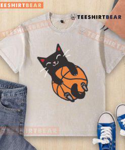 Adorable cat wearing a washed T-shirt with a basketball design, showcasing a playful and sporty vibe.