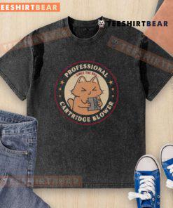 Cute cat graphic on a washed T-shirt featuring 'Pro Cartridge Blower Since the 80s' design for cat lovers.