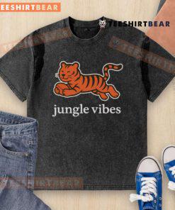 Man wearing a Cute Cincinnati Bengals Jungle Vibes Run Wild Washed T-Shirt, showcasing team spirit in a vibrant setting.