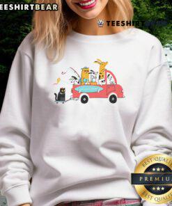 Adorable pets traveling in style wearing a cute sweatshirt, perfect for pet lovers on the go.