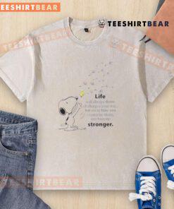 Cute Snoopy graphic on a washed t-shirt with the quote about overcoming challenges and becoming stronger.