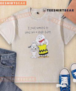 Cute Snoopy and Charlie Brown on a washed t-shirt with the phrase 'I Just Wanted to Send You a Smile Today.'