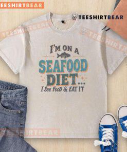 Funny 'I'm on a seafood diet' washed t-shirt featuring a humorous seafood joke for food lovers and shirt enthusiasts.