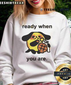 Cute dog wearing a Ready When You Are grenade sweatshirt, showcasing a funny and playful personality.