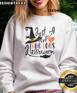 Good Just A Girl Who Loves Halloween sweatshirt featuring spooky graphics and a cozy design perfect for Halloween enthusiasts.