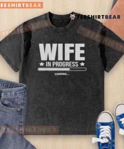 Good Wife In Progress Loading graphic on a washed t-shirt, showcasing a humorous and trendy design for casual wear.