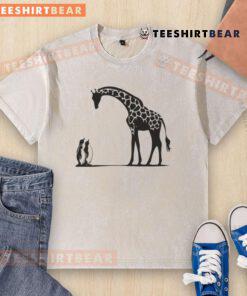 Alt Text: Happy penguin and giraffe on a tall and small washed t-shirt, perfect for kids' playful fashion.