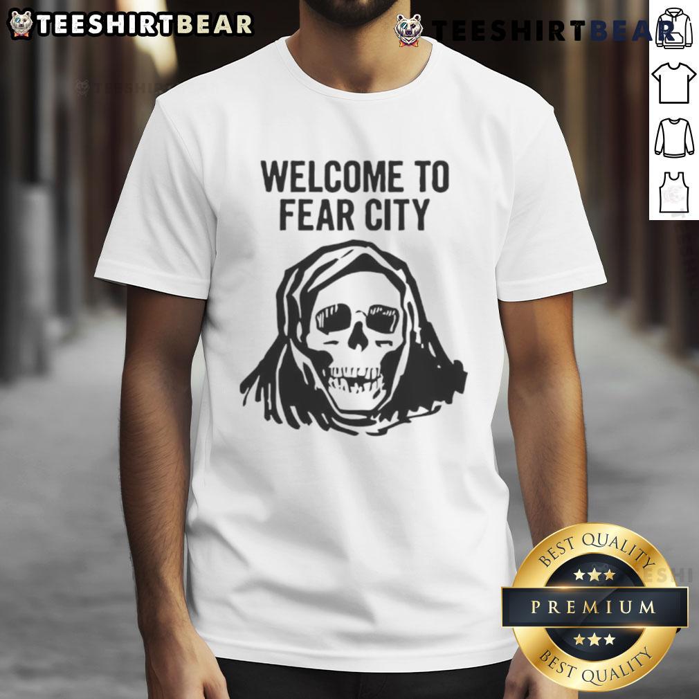 Alt Text: Happy Skull Welcome To Fear City T-Shirt design featuring a cheerful skull graphic on a black background.