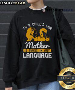 Happy child wearing 'Mother Is Magic In Any Language' sweatshirt, showcasing love and warmth in a joyful moment.
