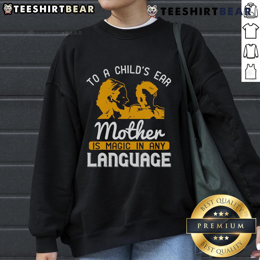 Happy child wearing 'Mother Is Magic In Any Language' sweatshirt, showcasing love and warmth in a joyful moment.