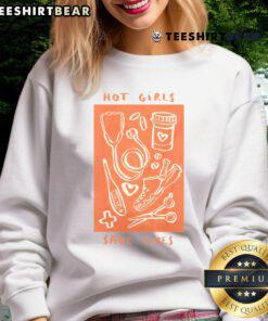 Hot Girls Save Lives sweatshirt featuring a nurse in medical scrubs, promoting healthcare worker pride and support.